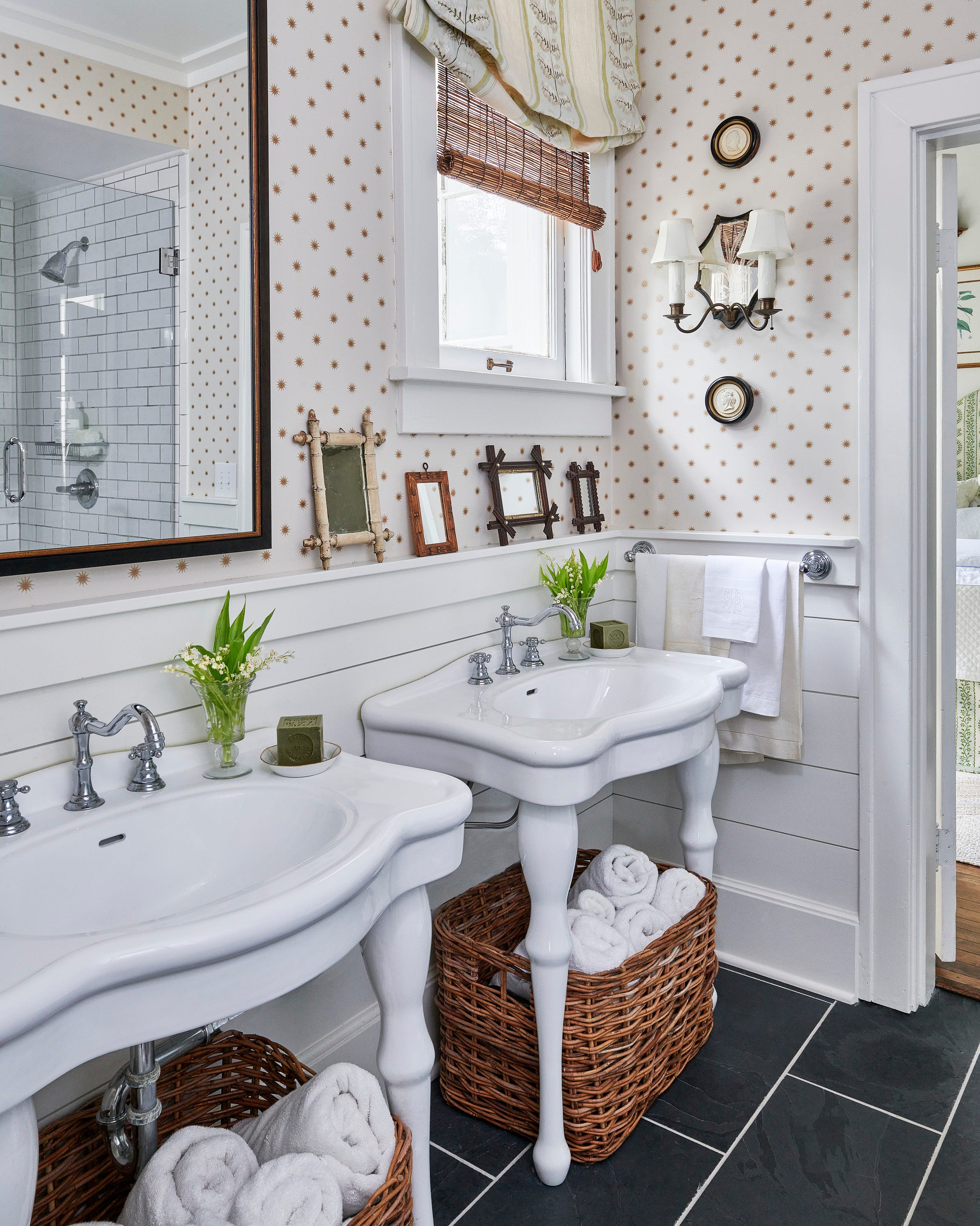 arkansas farmhouse designed by interior designer heather chadduck hillegas elizabeth poindexter shackelford, homeowner a star patterned wallpaper colefax and fowler and slate flooring ground the bath in captivating simplicity bathroom